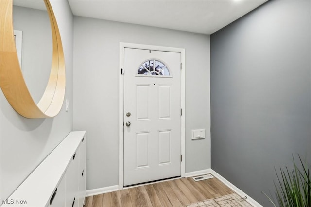 foyer entrance with light hardwood / wood-style flooring