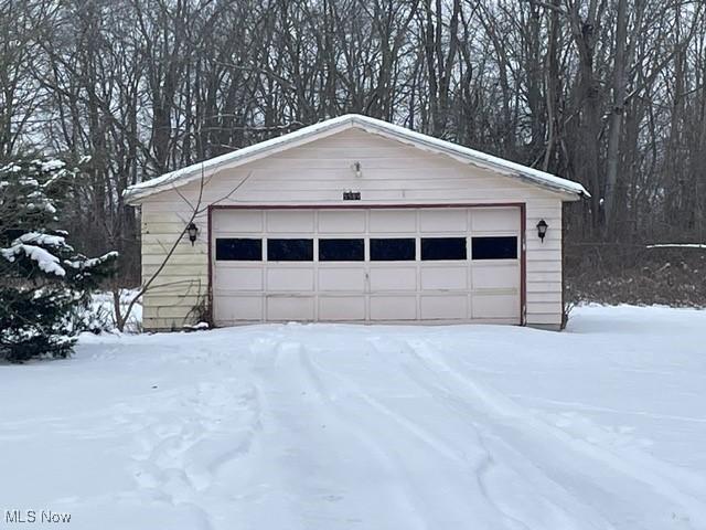 view of snow covered garage