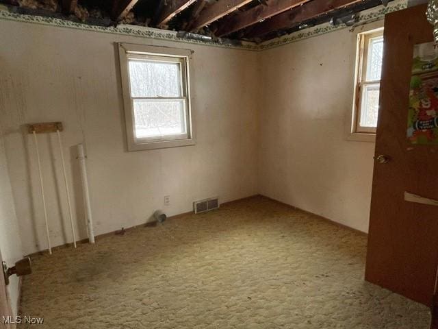 empty room featuring carpet floors