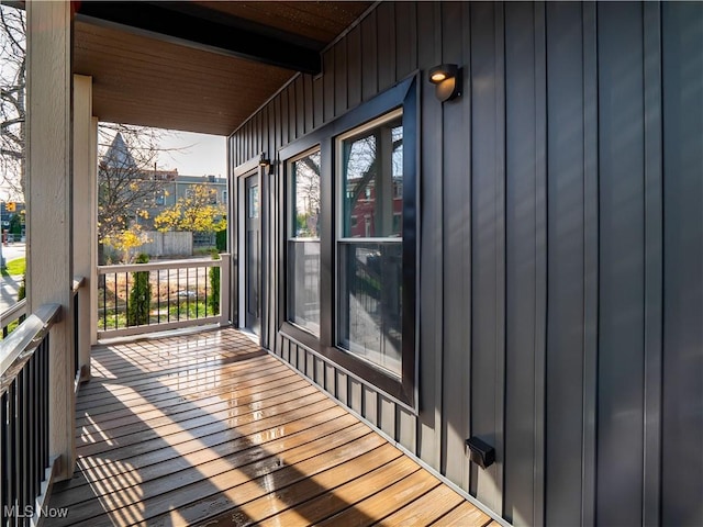 wooden terrace featuring covered porch