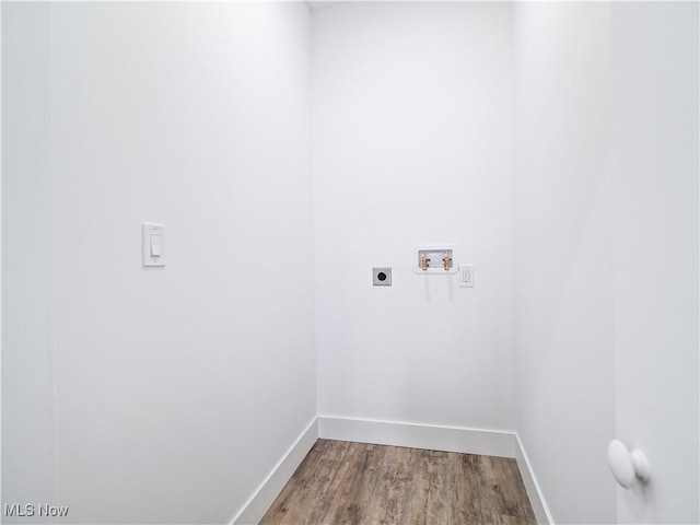 washroom featuring hardwood / wood-style flooring, washer hookup, and hookup for an electric dryer