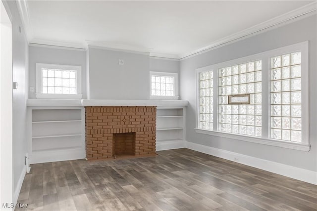 unfurnished living room featuring a fireplace, hardwood / wood-style floors, and ornamental molding