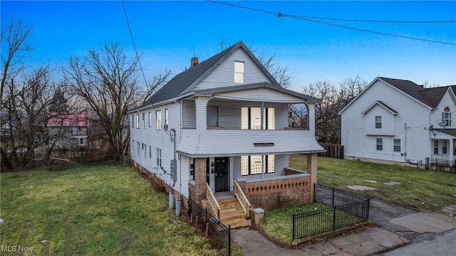 view of front facade with a front lawn and a porch