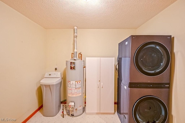 laundry room with stacked washing maching and dryer, a textured ceiling, and gas water heater