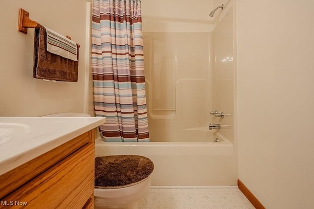 full bathroom featuring vanity, shower / bath combo, and toilet