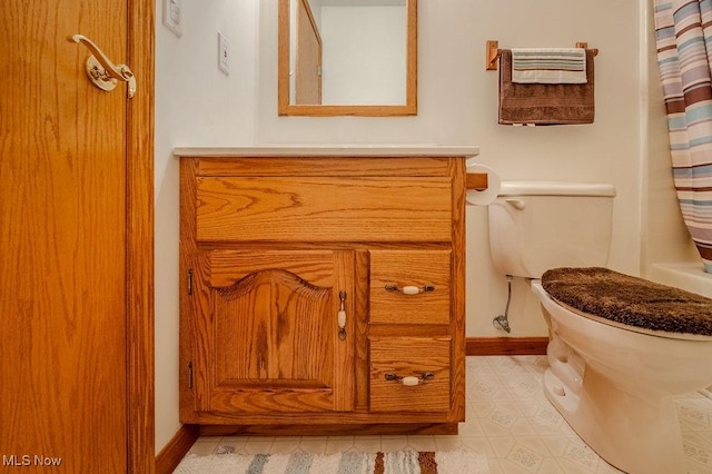 bathroom with vanity and toilet