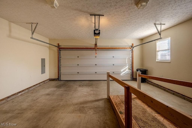 garage with electric panel and a garage door opener