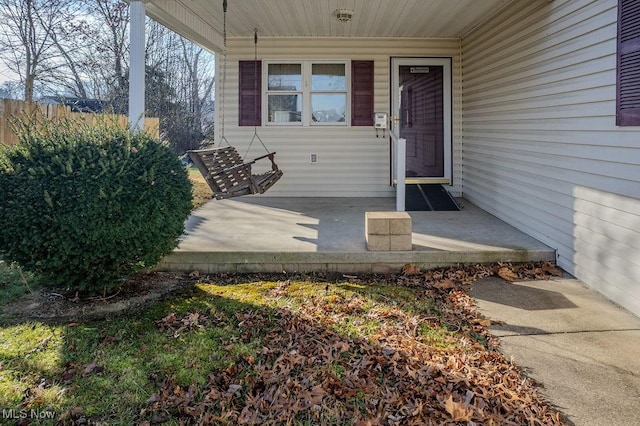 doorway to property with covered porch