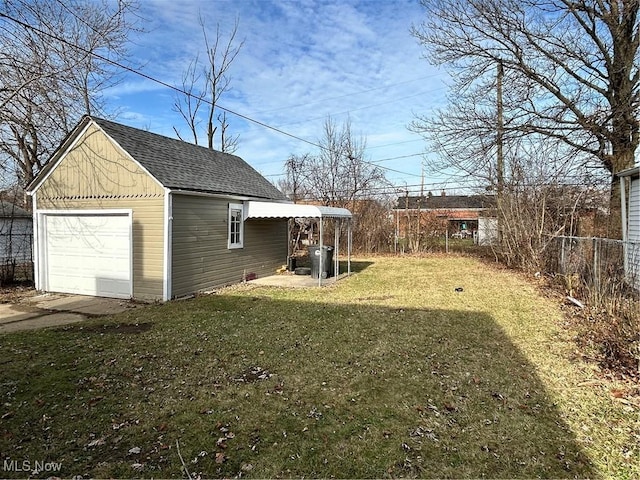 view of yard featuring an outbuilding and a garage