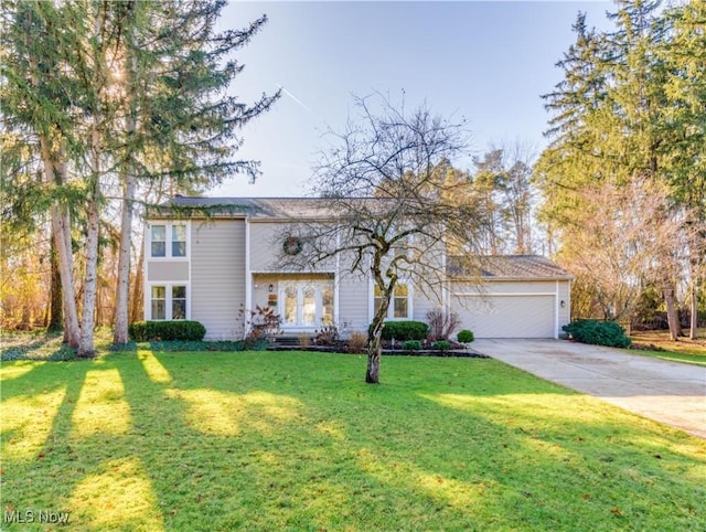 view of front of house featuring a garage and a front lawn