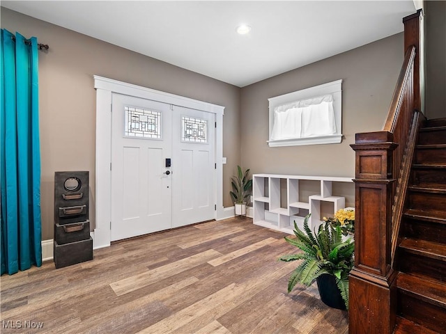 entrance foyer with hardwood / wood-style floors