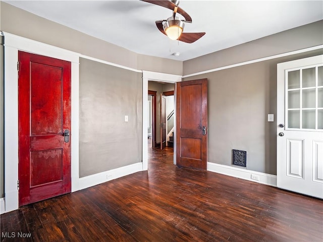 entryway with dark hardwood / wood-style flooring and ceiling fan