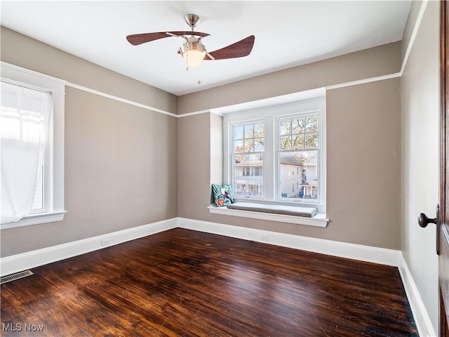 unfurnished room with ceiling fan and hardwood / wood-style floors