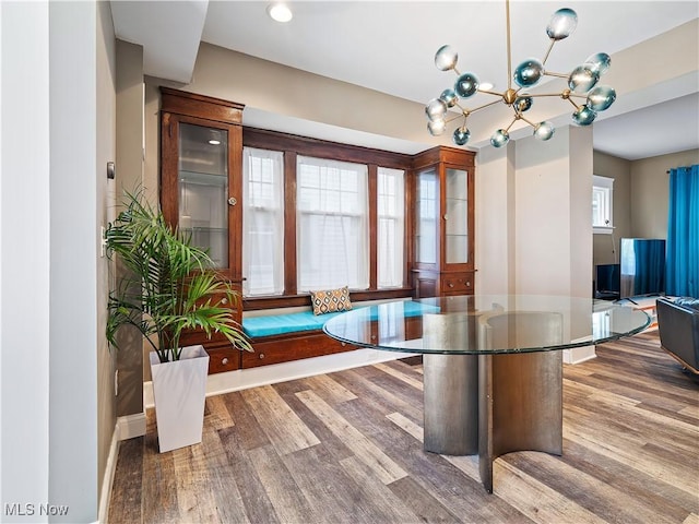 interior space featuring dark hardwood / wood-style flooring and a chandelier