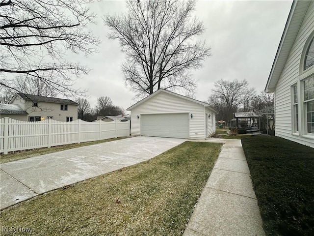 exterior space featuring a yard, an outdoor structure, and a garage