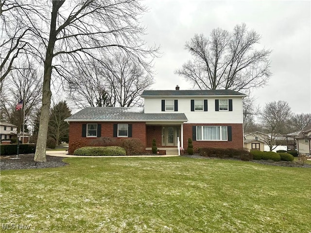 view of property featuring a front lawn