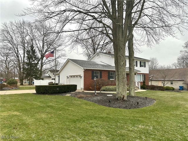 view of side of property with a yard and a garage