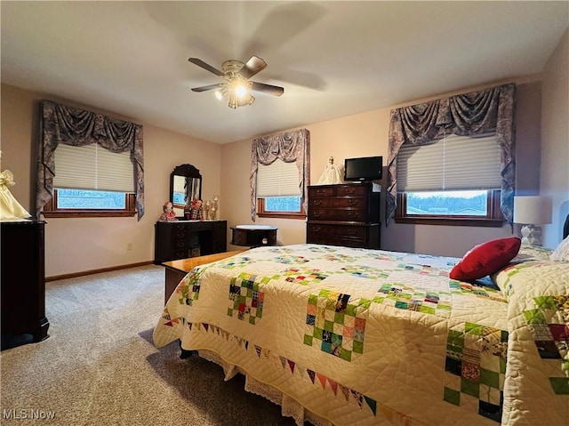 bedroom with ceiling fan and light colored carpet