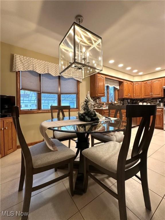 tiled dining area with a healthy amount of sunlight