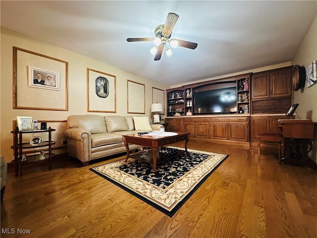 living room with ceiling fan and hardwood / wood-style flooring