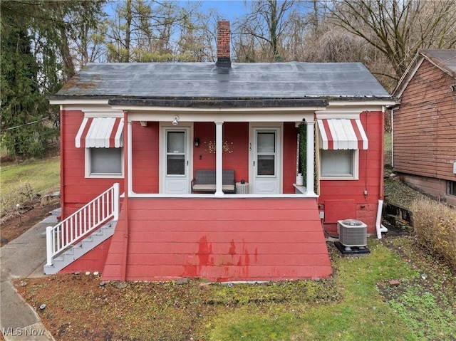 view of outdoor structure featuring central AC unit