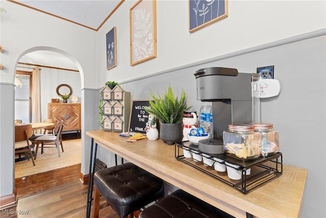 kitchen with crown molding and wood-type flooring