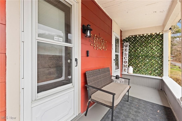 doorway to property featuring a porch