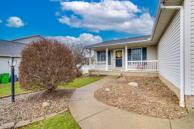 property entrance featuring covered porch