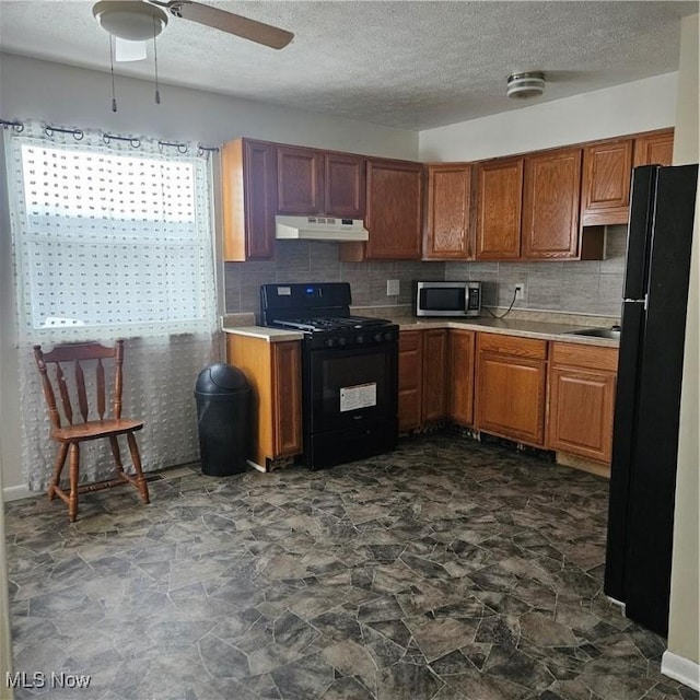 kitchen with backsplash, ceiling fan, and black appliances