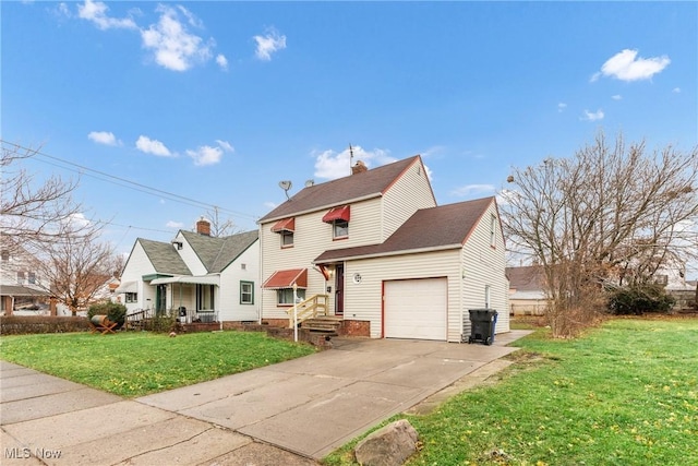 view of front of property with a front yard and a garage