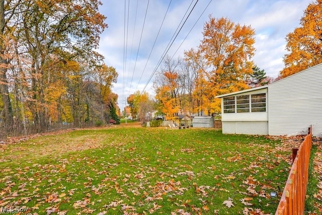 view of yard with a sunroom