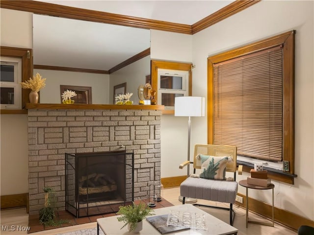 living area featuring a brick fireplace and ornamental molding