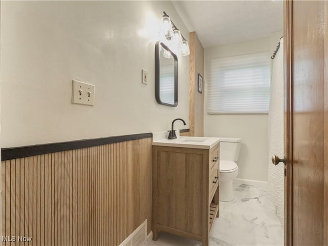 bathroom with vanity and toilet