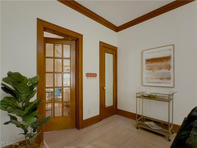 doorway featuring crown molding and light parquet flooring