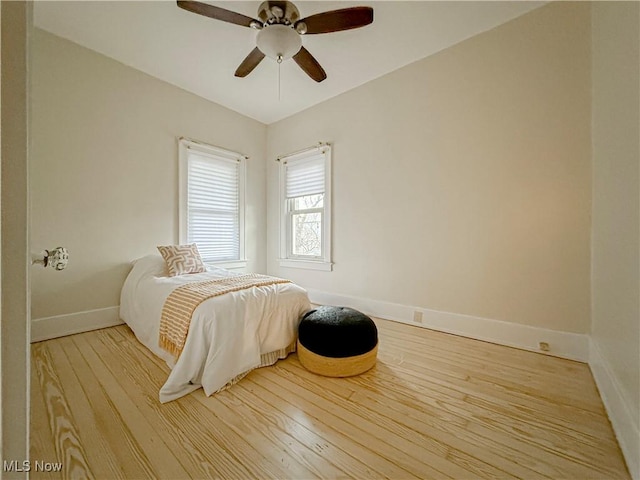 bedroom featuring ceiling fan and light hardwood / wood-style flooring