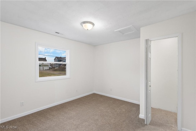 view of carpeted spare room