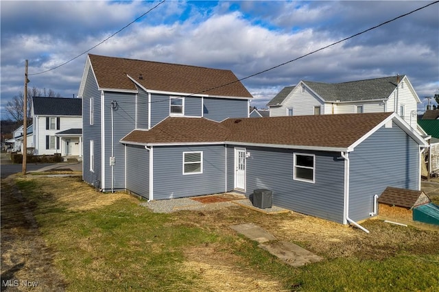 back of house with a yard