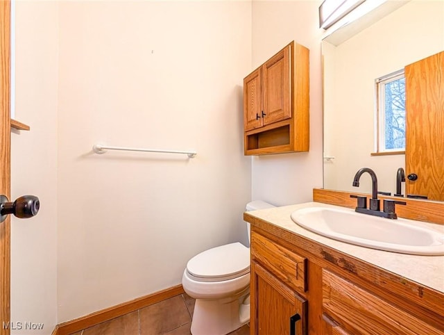 bathroom with tile patterned floors, vanity, and toilet