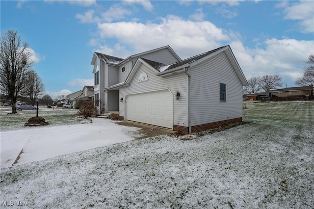 view of snowy exterior featuring a garage