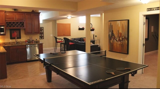 game room featuring light parquet floors and wet bar