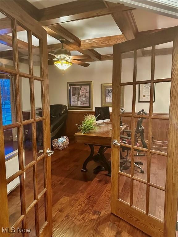 home office with coffered ceiling, french doors, hardwood / wood-style flooring, ceiling fan, and beamed ceiling