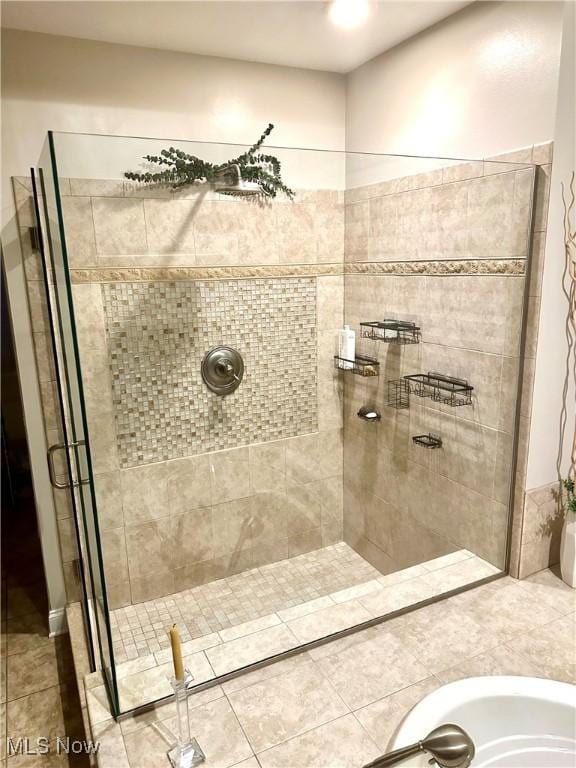 bathroom with a shower with shower door