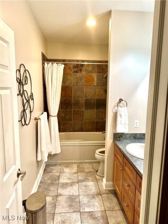 full bathroom with vanity, shower / bath combination with curtain, and toilet