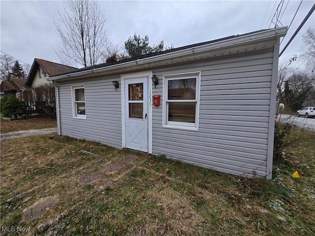 rear view of house with a lawn