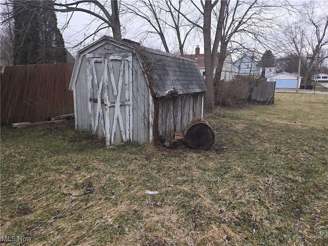 view of outbuilding with a yard