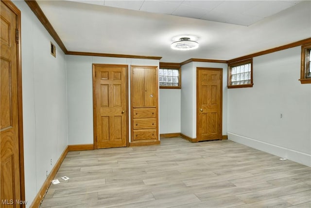 unfurnished bedroom with light hardwood / wood-style floors and ornamental molding