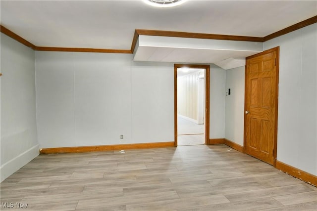 unfurnished room featuring light hardwood / wood-style flooring and ornamental molding