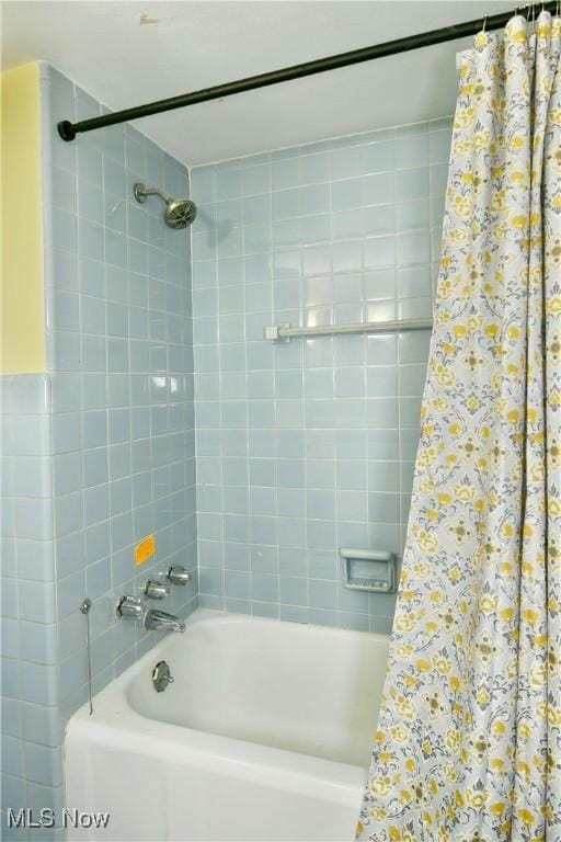 bathroom featuring shower / bath combination with curtain