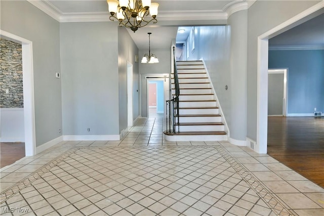 stairs featuring crown molding, tile patterned flooring, and a notable chandelier