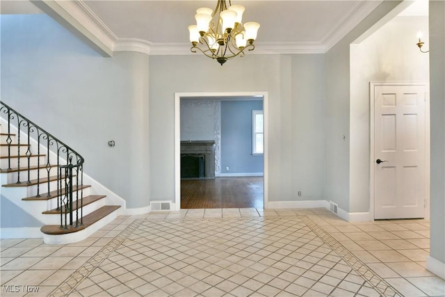 interior space with crown molding and a chandelier